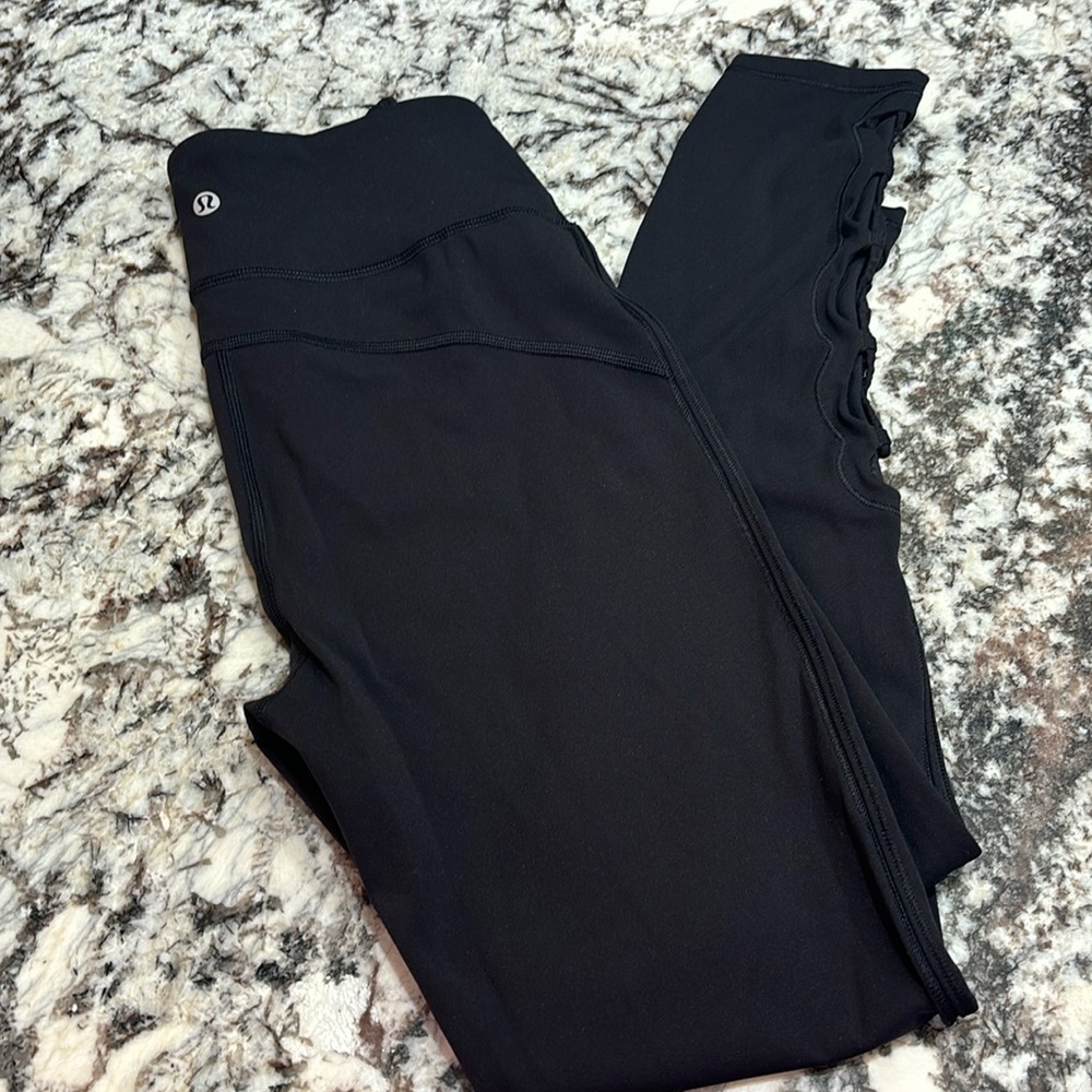 Lululemon black mesh criss cross crop leggings